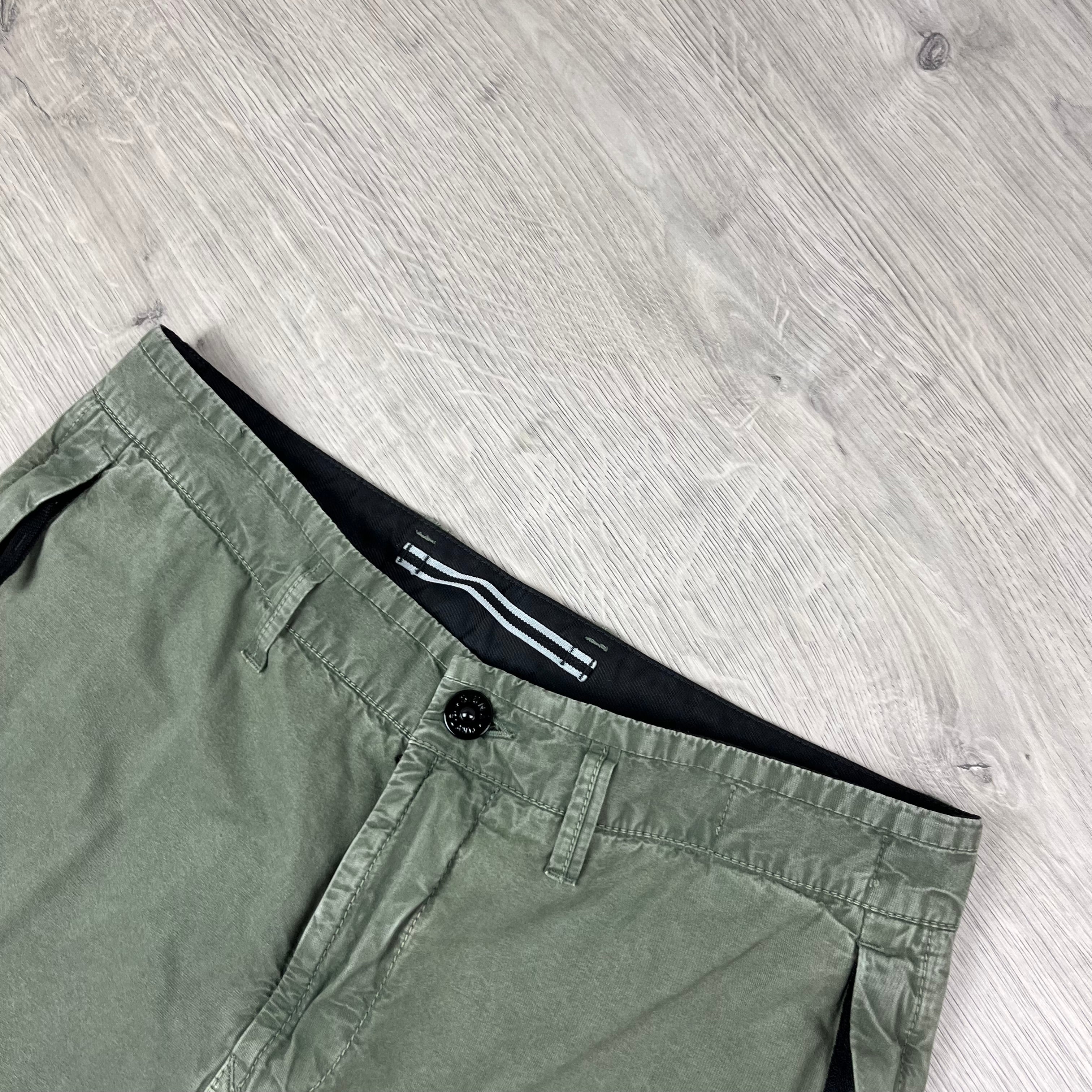 Stone Island Bermuda Cargo Shorts in Musk Green. On sale at Open Attire.