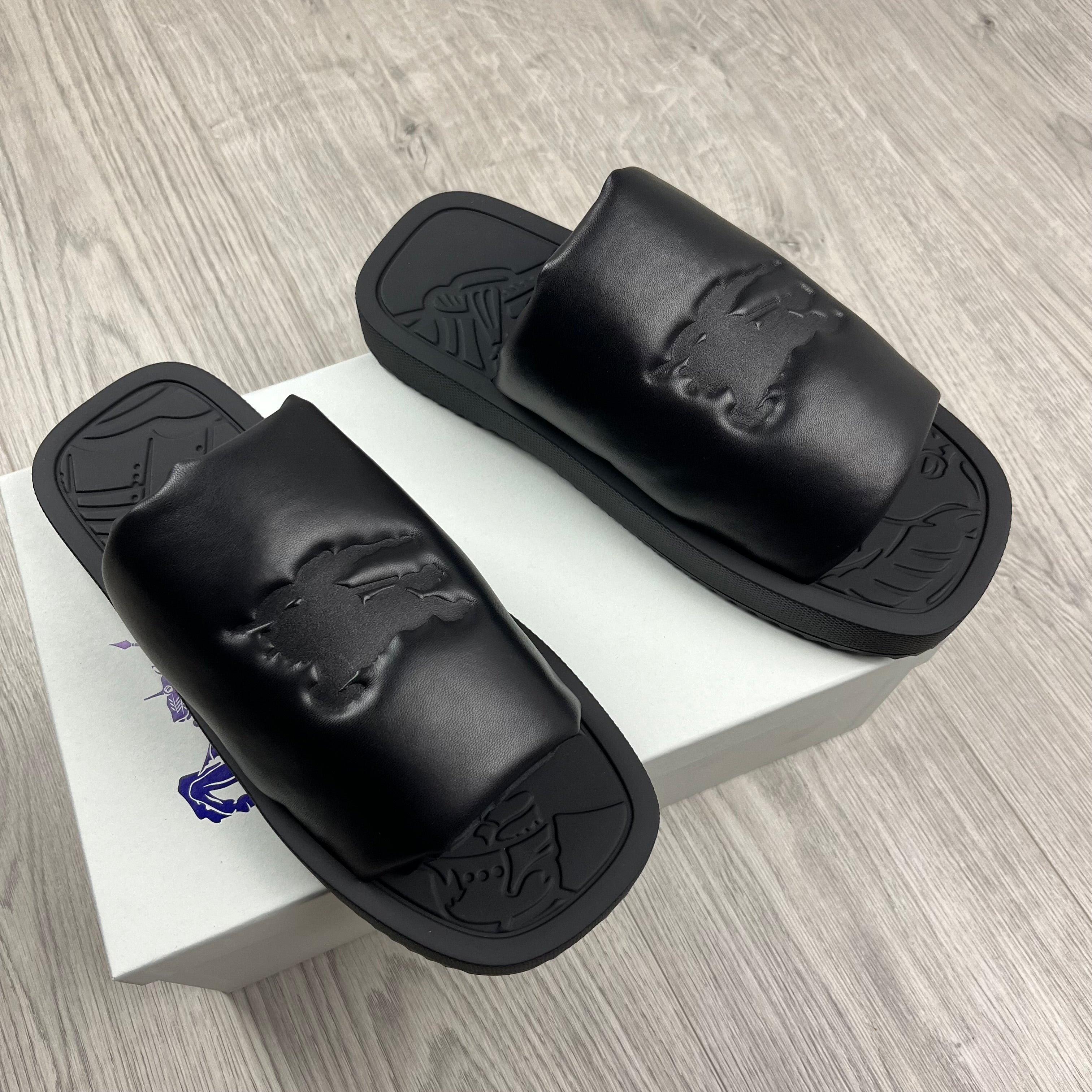 Burberry EKD Slab Slides in Black. On sale at Open Attire.