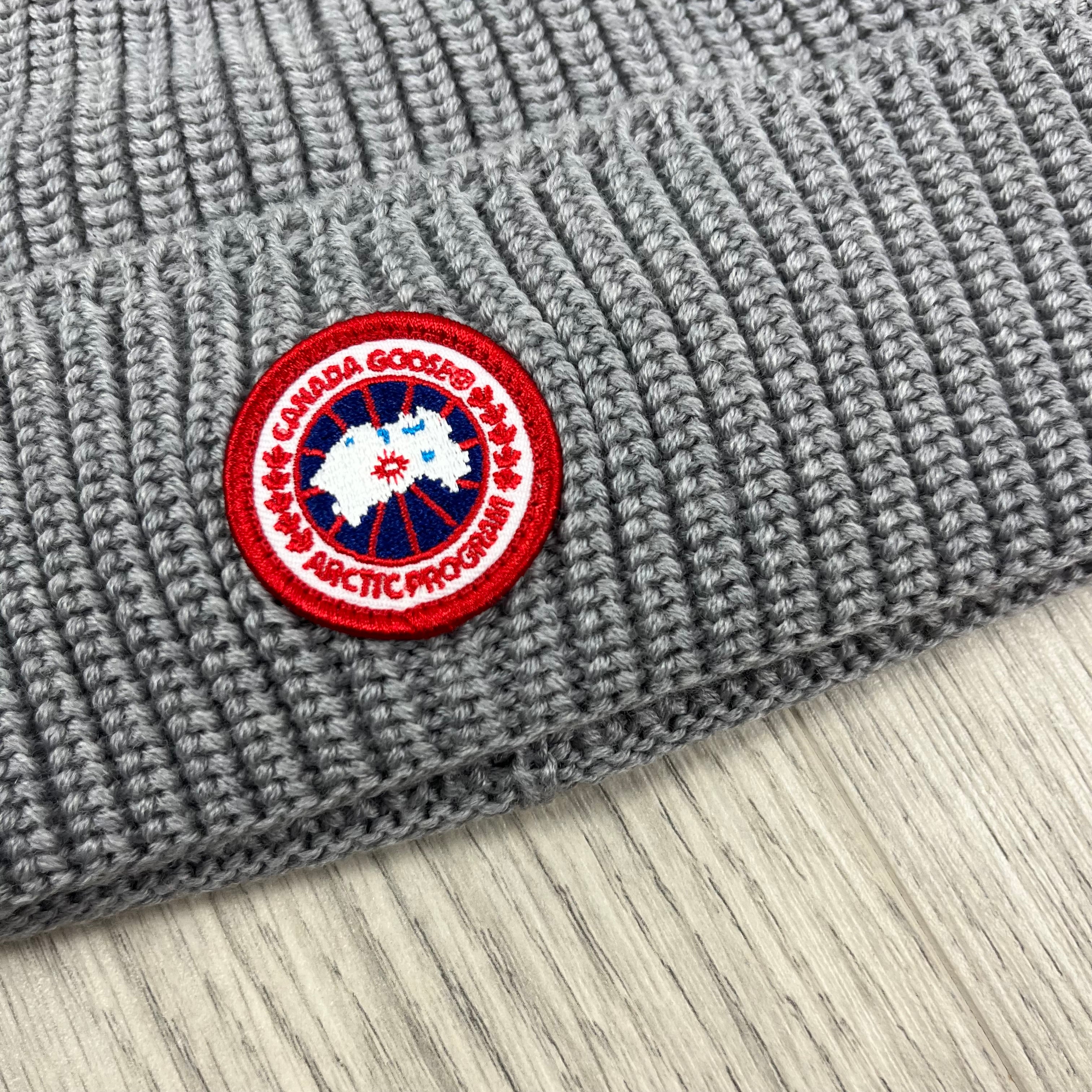 Men's Canada Goose Ribbed Beanie in Heather Grey. On sale at Open Attire.