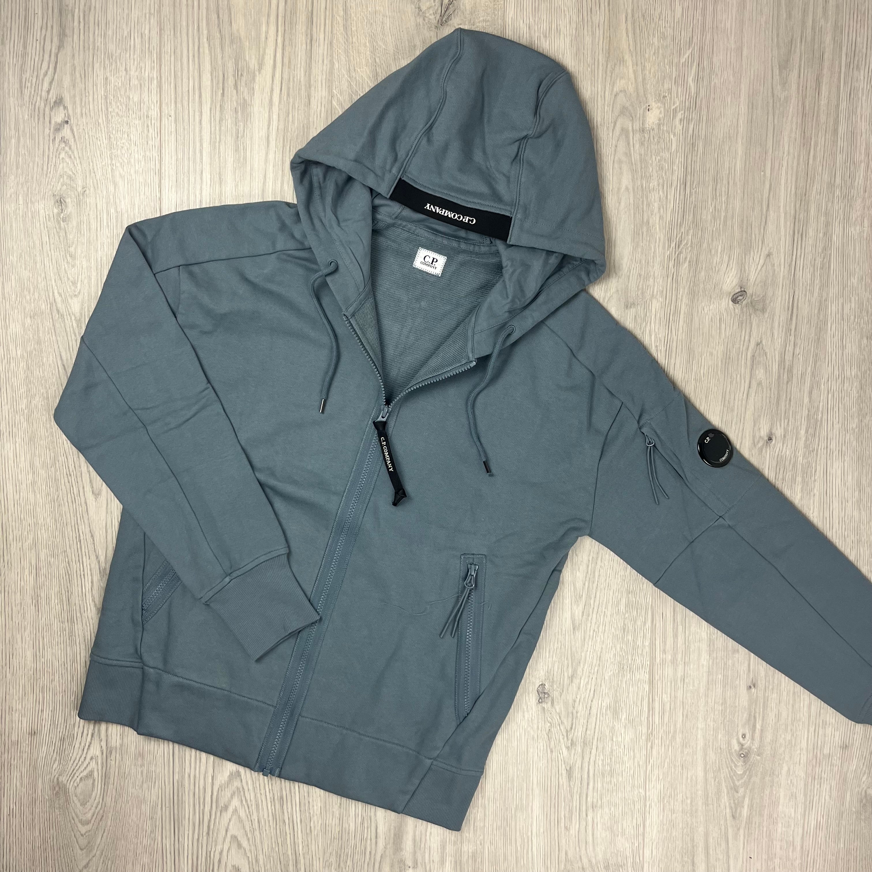 CP Company Diagonal Raised Fleece Zipped Hoodie in Stormy Weather. On Sale at Open Attire.