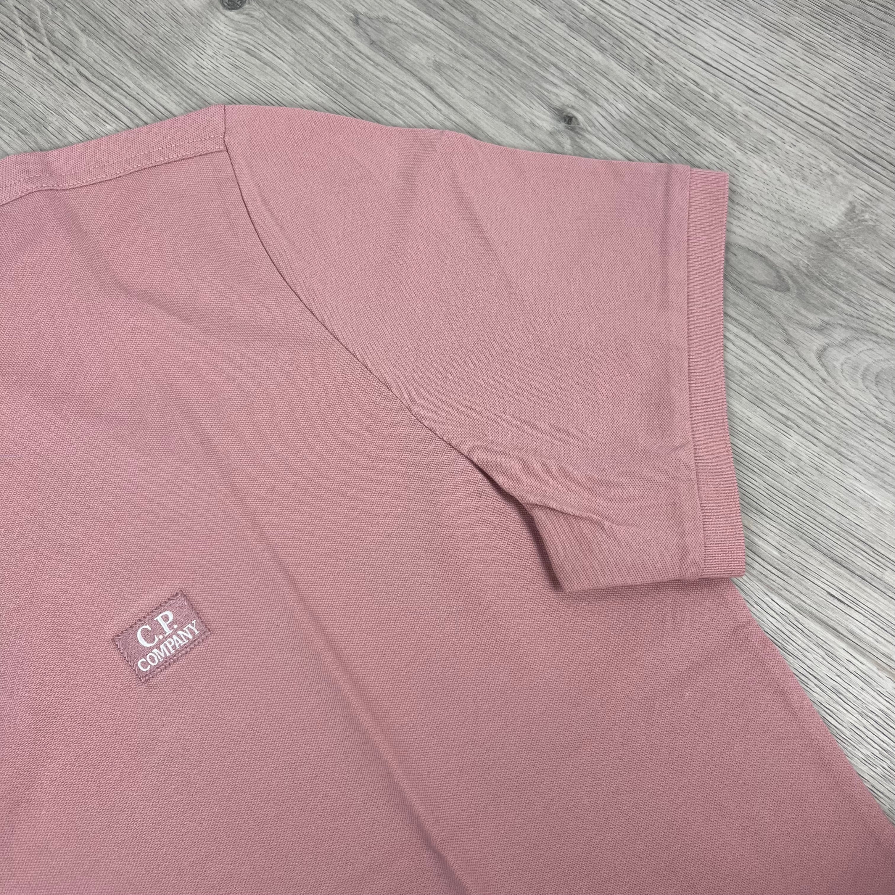 CP Company Piquet Polo Shirt in Misty Rose. On sale at Open Attire.