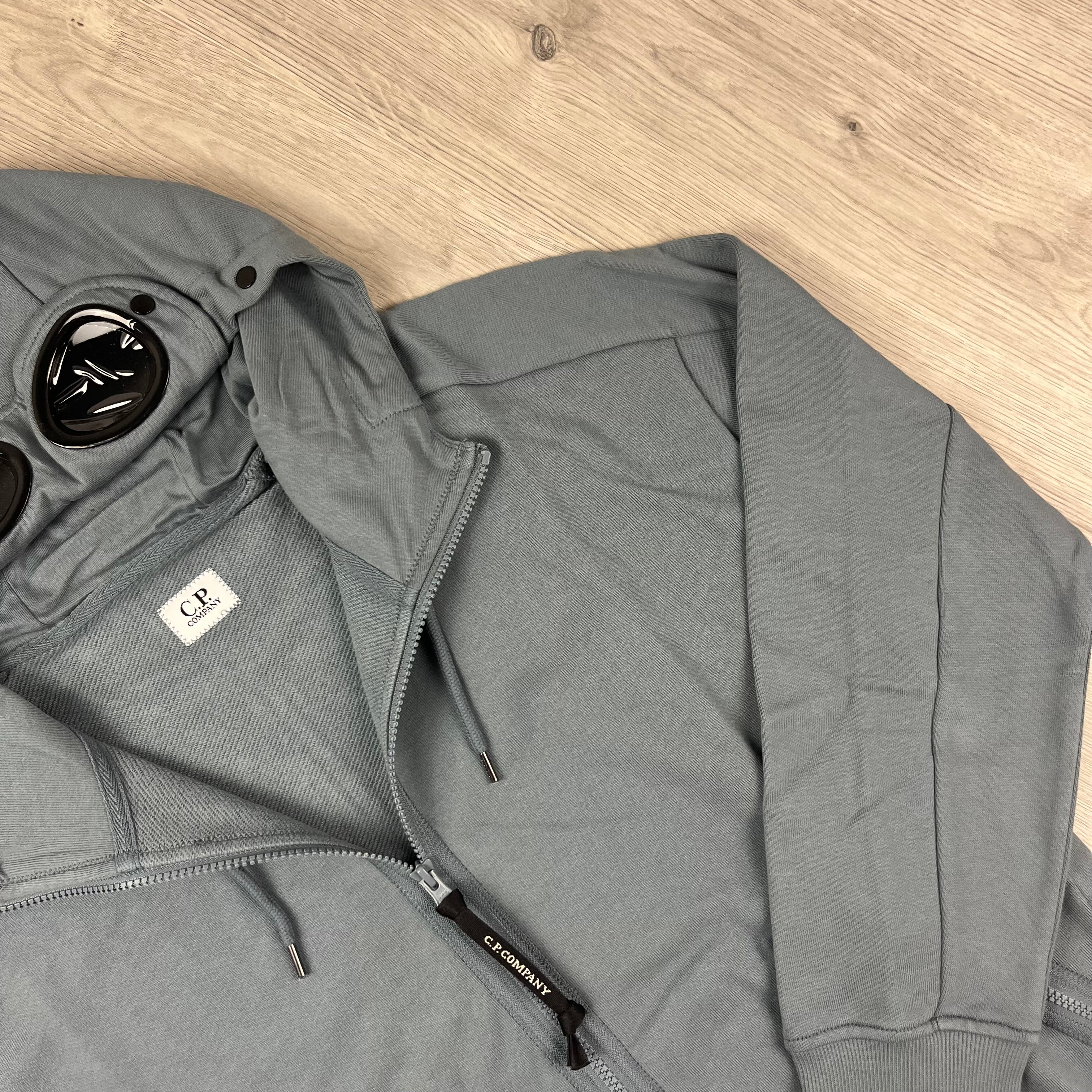 CP Company Diagonal Raised Fleece Goggle Hoodie in Stormy Weather. On sale at Open Attire.