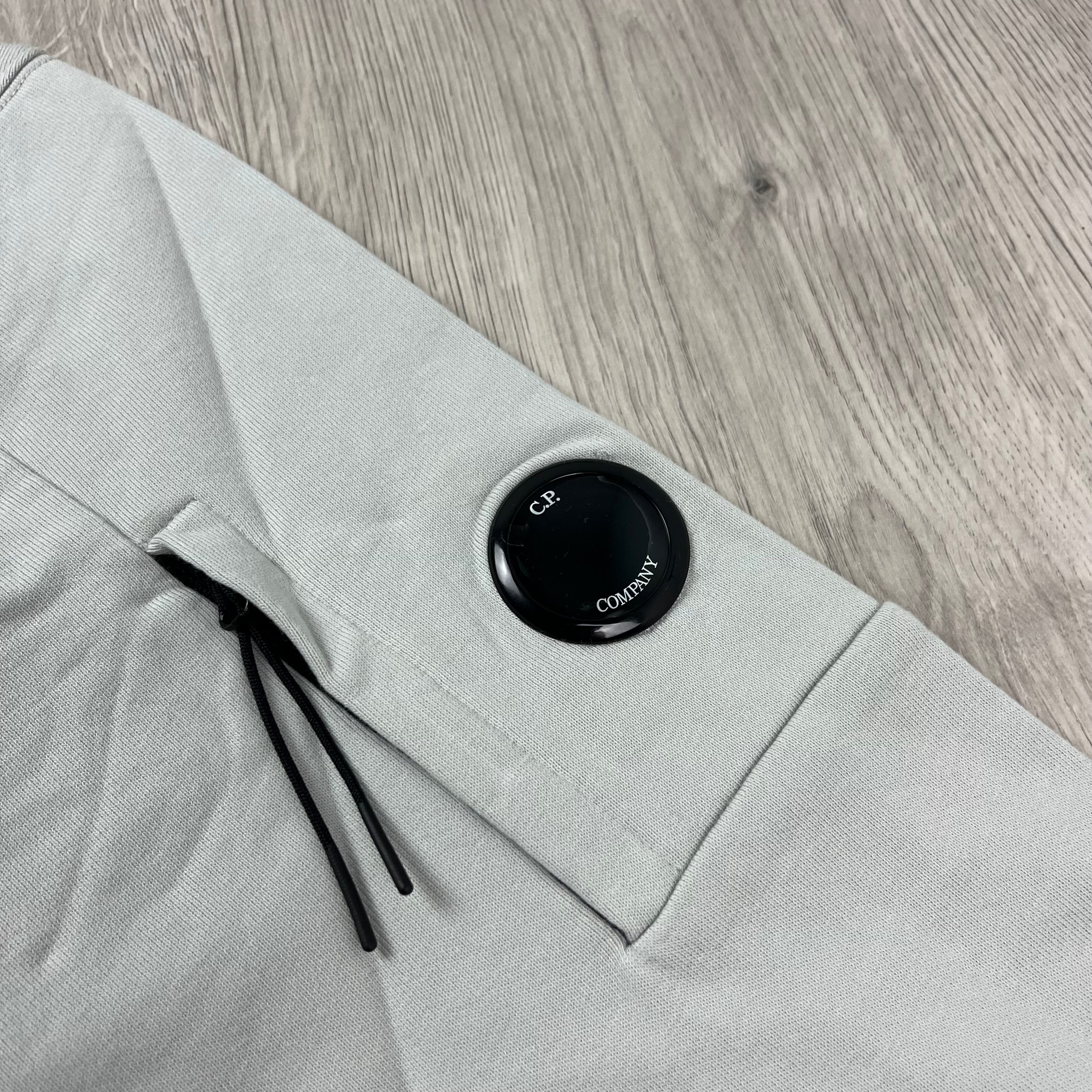 CP Company Diagonal Raised Fleece Hoodie in Blue Fox. On sale at Open Attire.