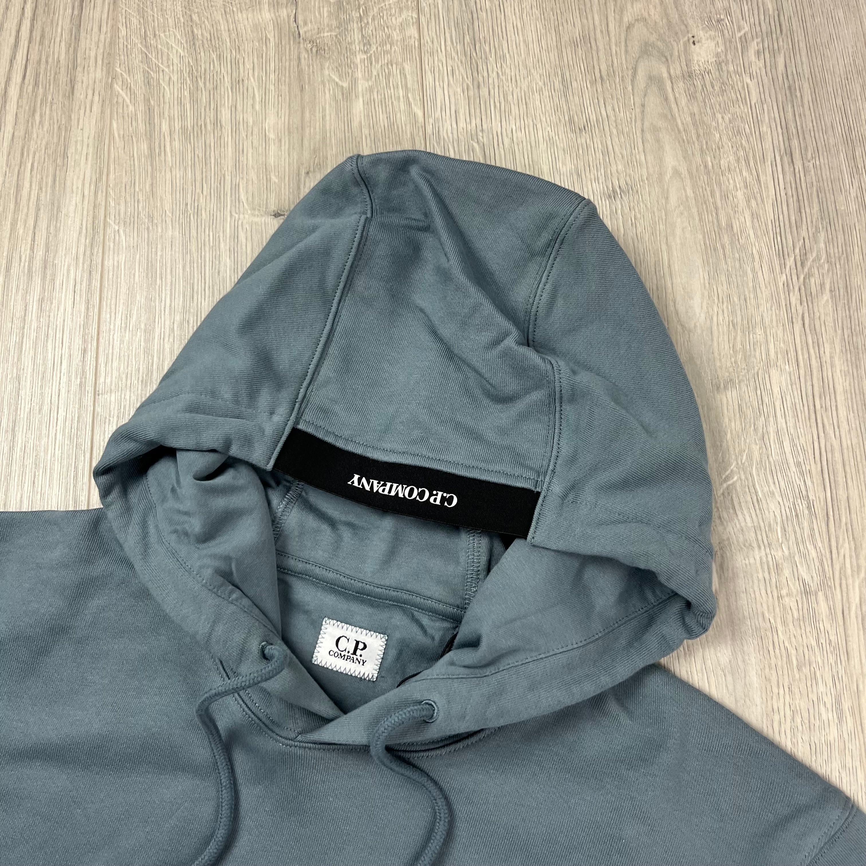 CP Company Diagonal Raised Fleece Hoodie in Stormy Weather. On sale at Open Attire.