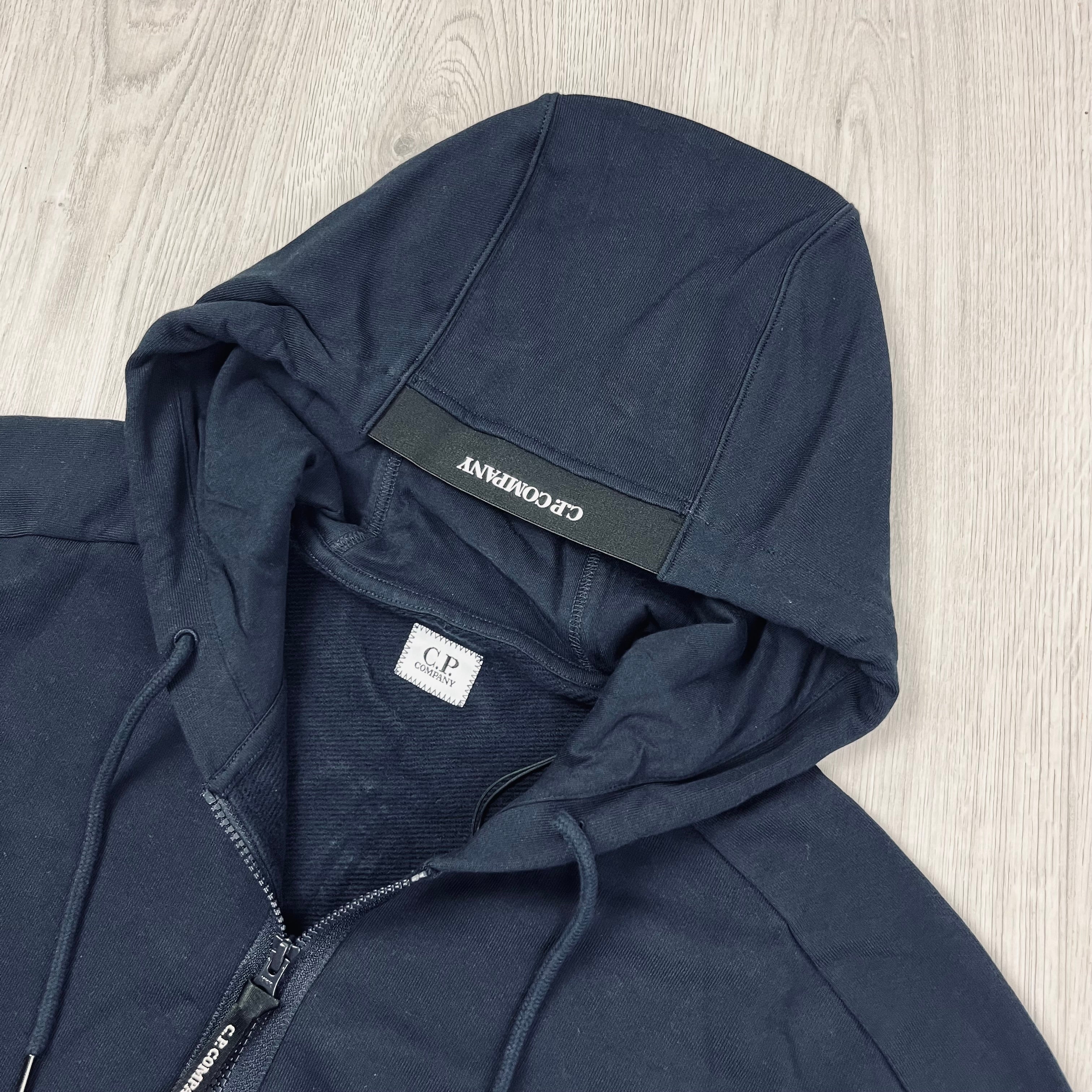 CP Company Diagonal Raised Fleece Zip Hoodie in Total Eclipse Navy Blue. On Sale at Open Attire.