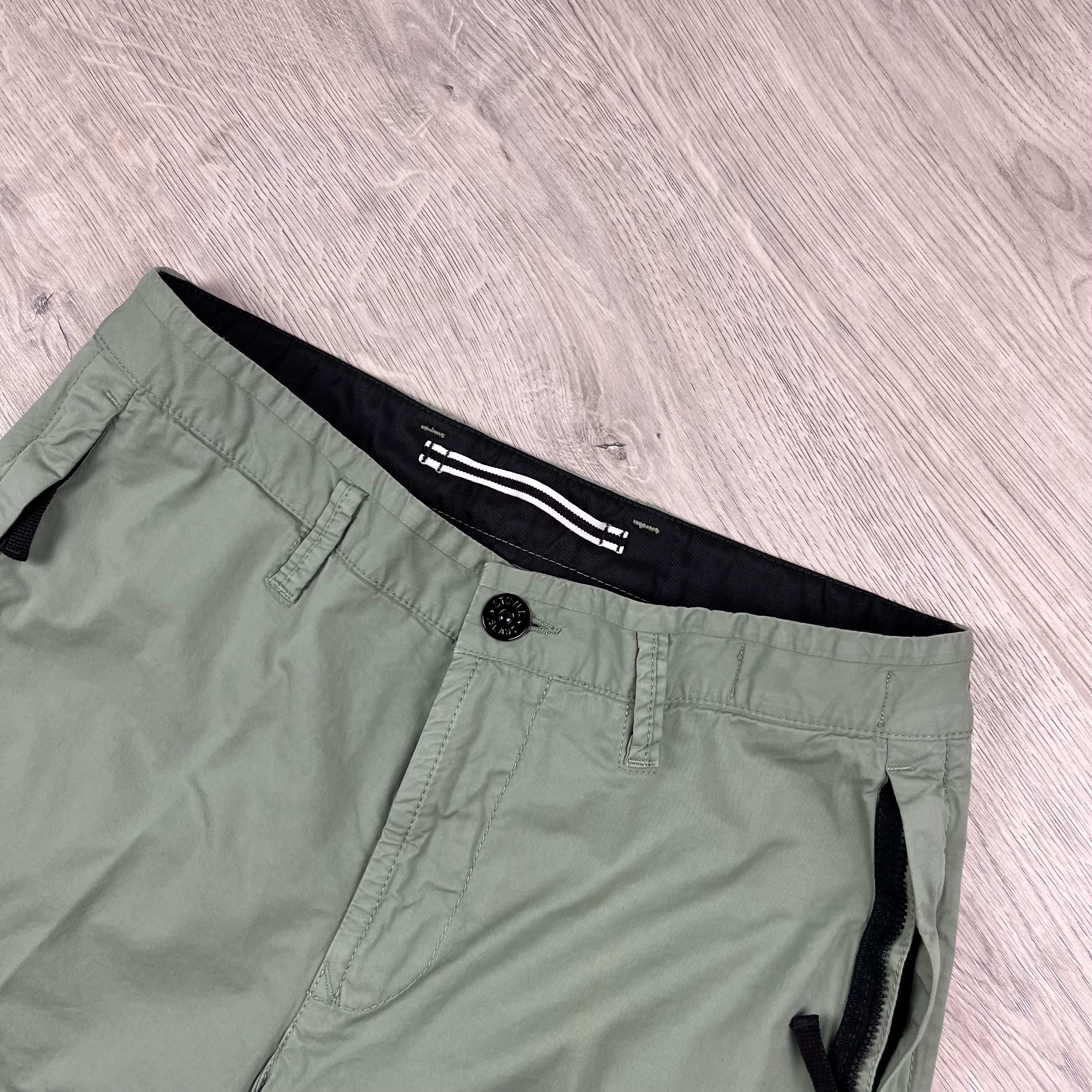 Stone Island Bermuda Cargo Shorts in Sage Green. On sale at Open Attire.