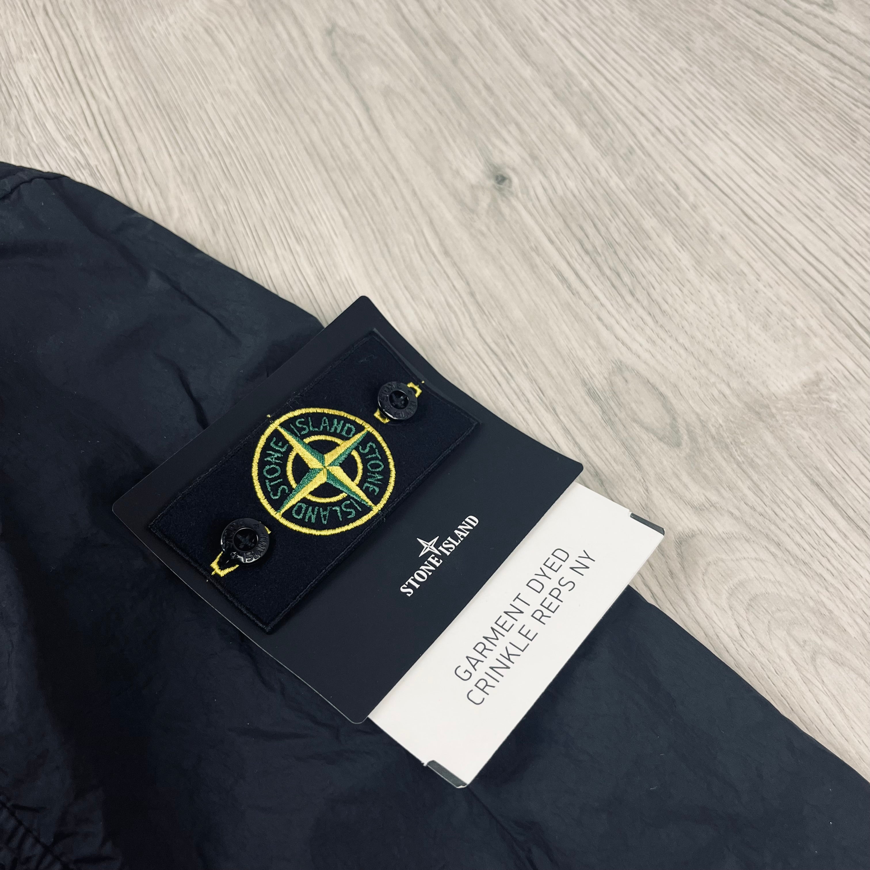 Stone Island Crinkle Reps R-NY Jacket in Black. On sale at Open Attire.