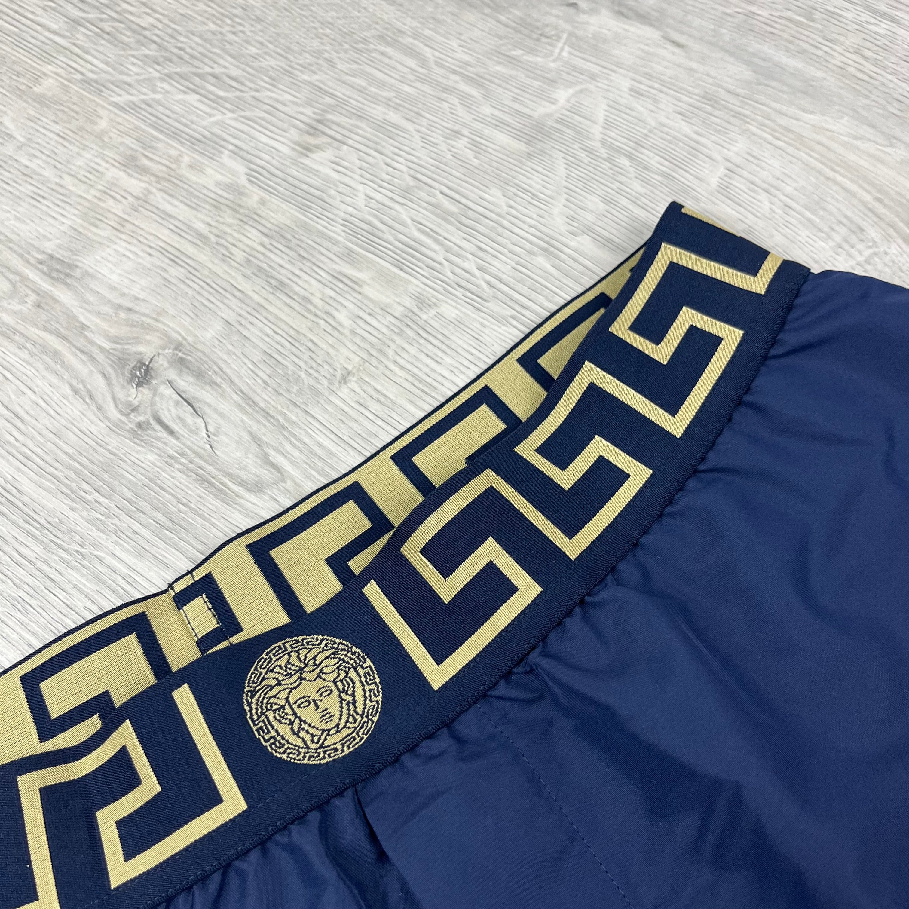 Versace Greca Swim Shorts in Navy Blue. On sale at Open Attire