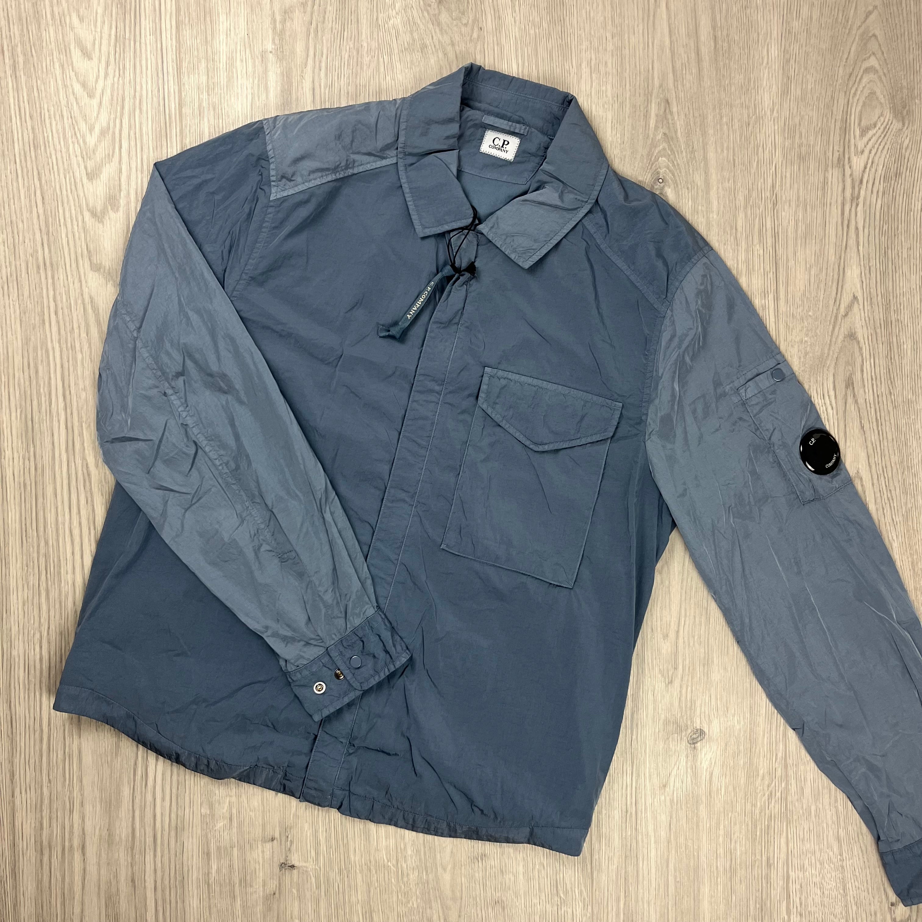 CP Company Chrome-R Lens Overshirt in Flintstone Blue. On sale at Open Attire.