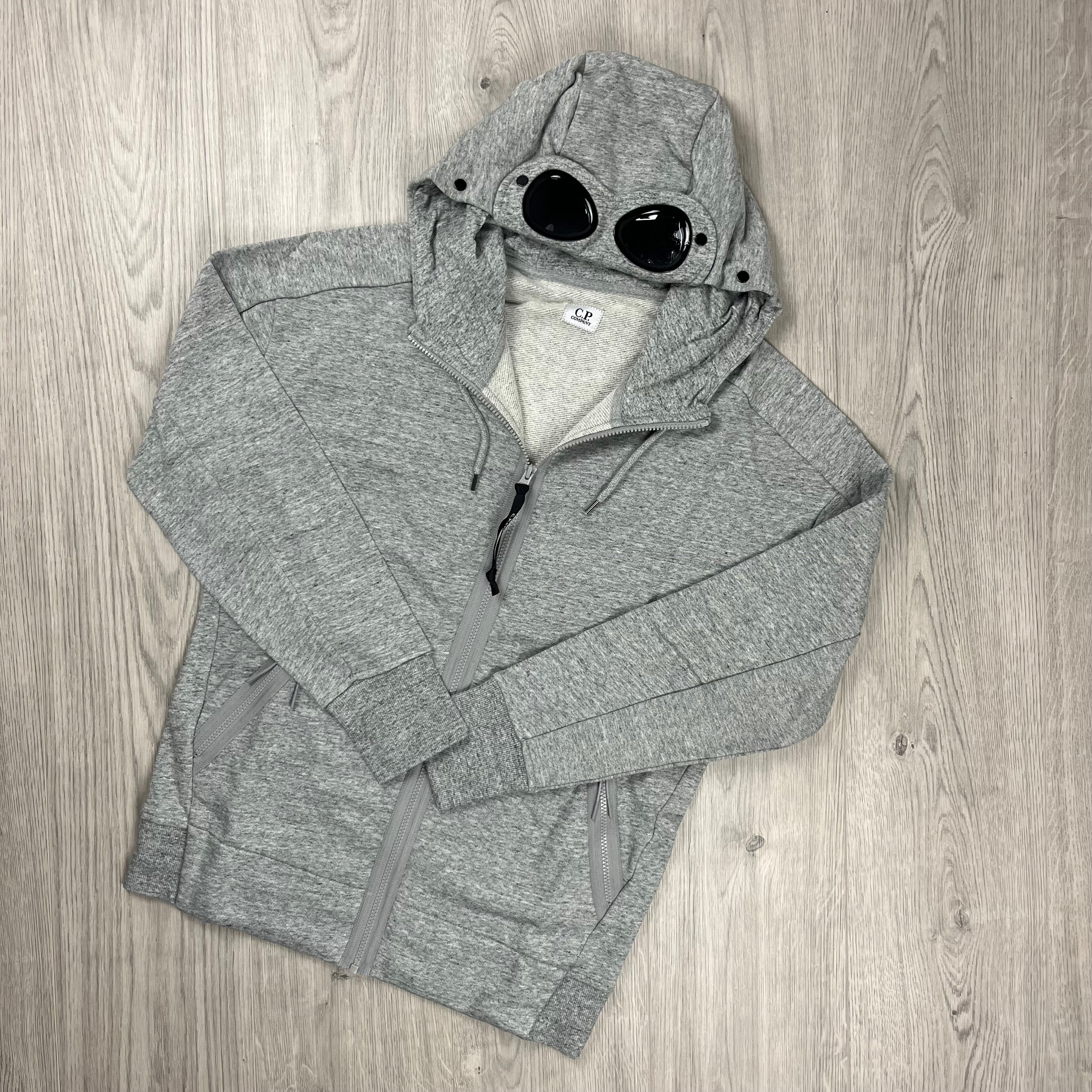 CP Company Raised Fleece Goggle Hoodie in Greystone Melange. On sale at Open Attire. 