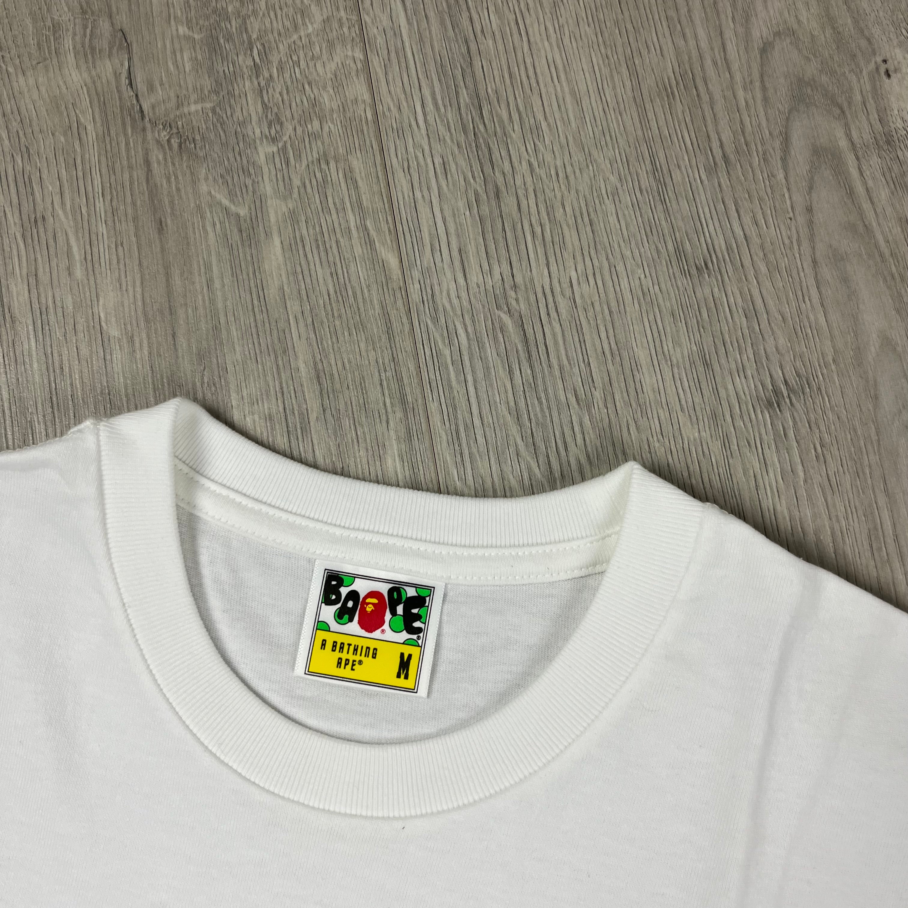 A Bathing Ape 'Ape Head' Tie Dye T-Shirt in White. On sale at Open Attire. 