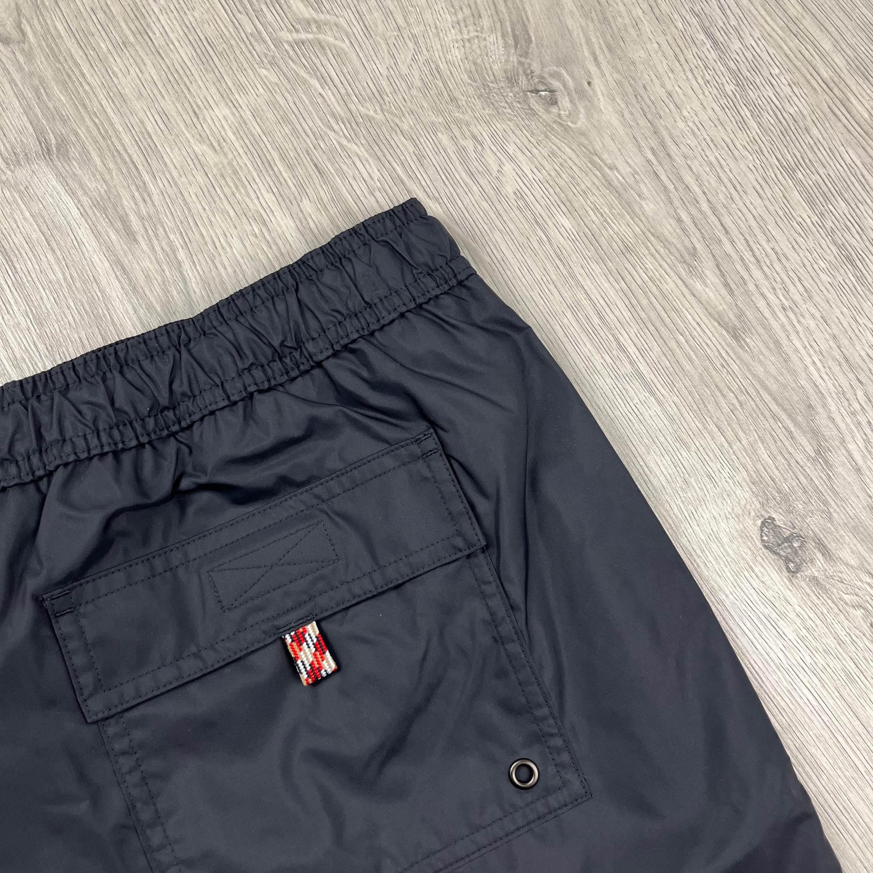 Burberry 'Greenford' Swim Shorts in Black. On sale at Open Attire.