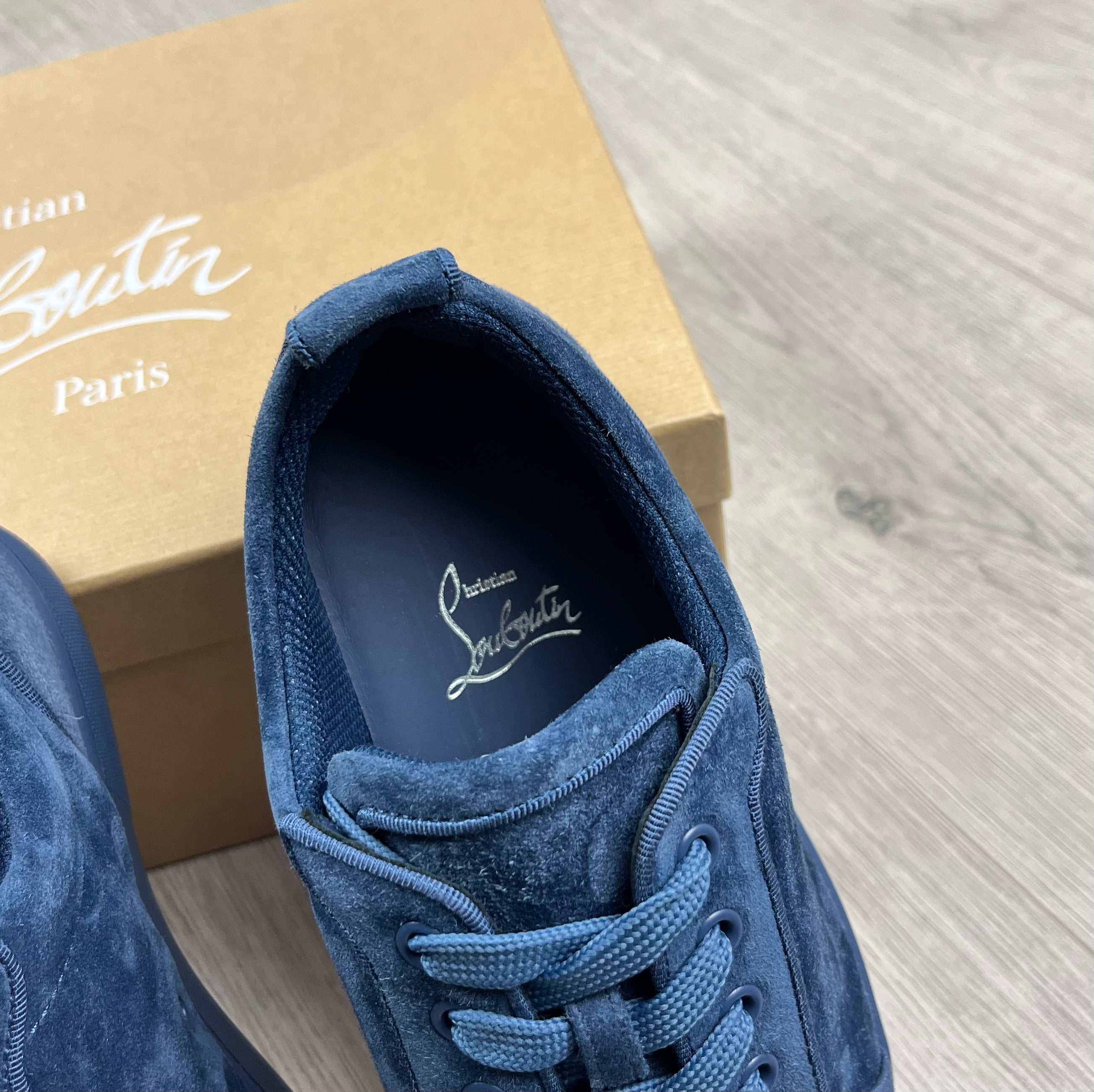 Christian Louboutin Louis Junior Sneakers in Denim Blue. On sale at Open Attire.