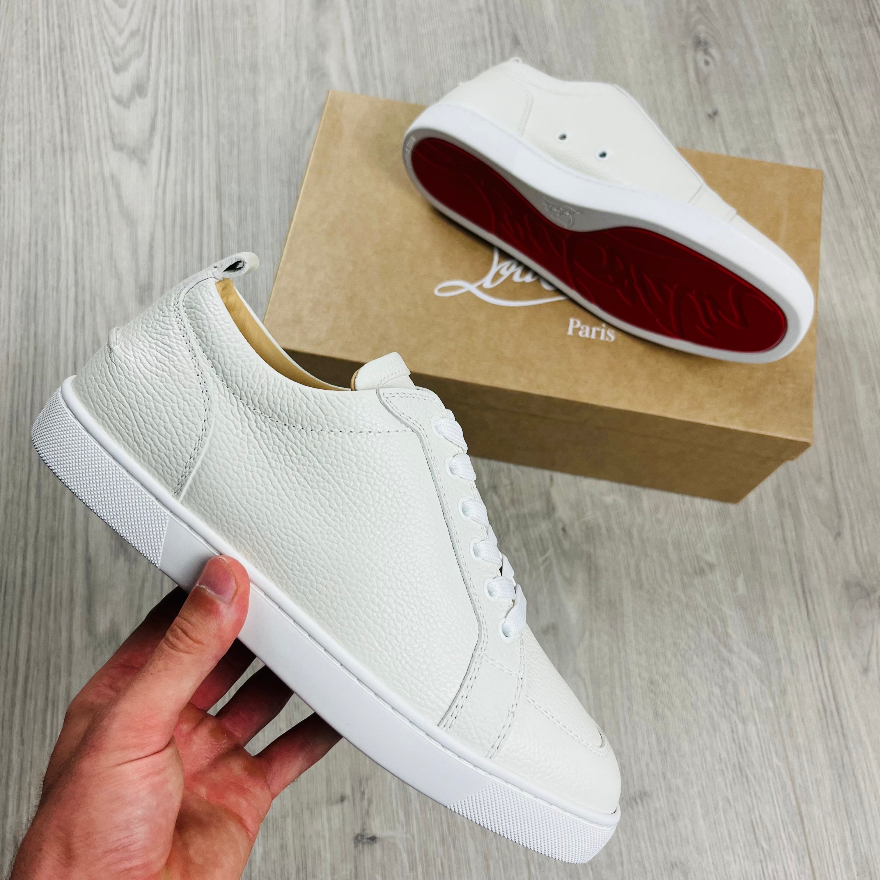 Christian Louboutin Rantulow Sneakers in White. On sale at Open Attire.