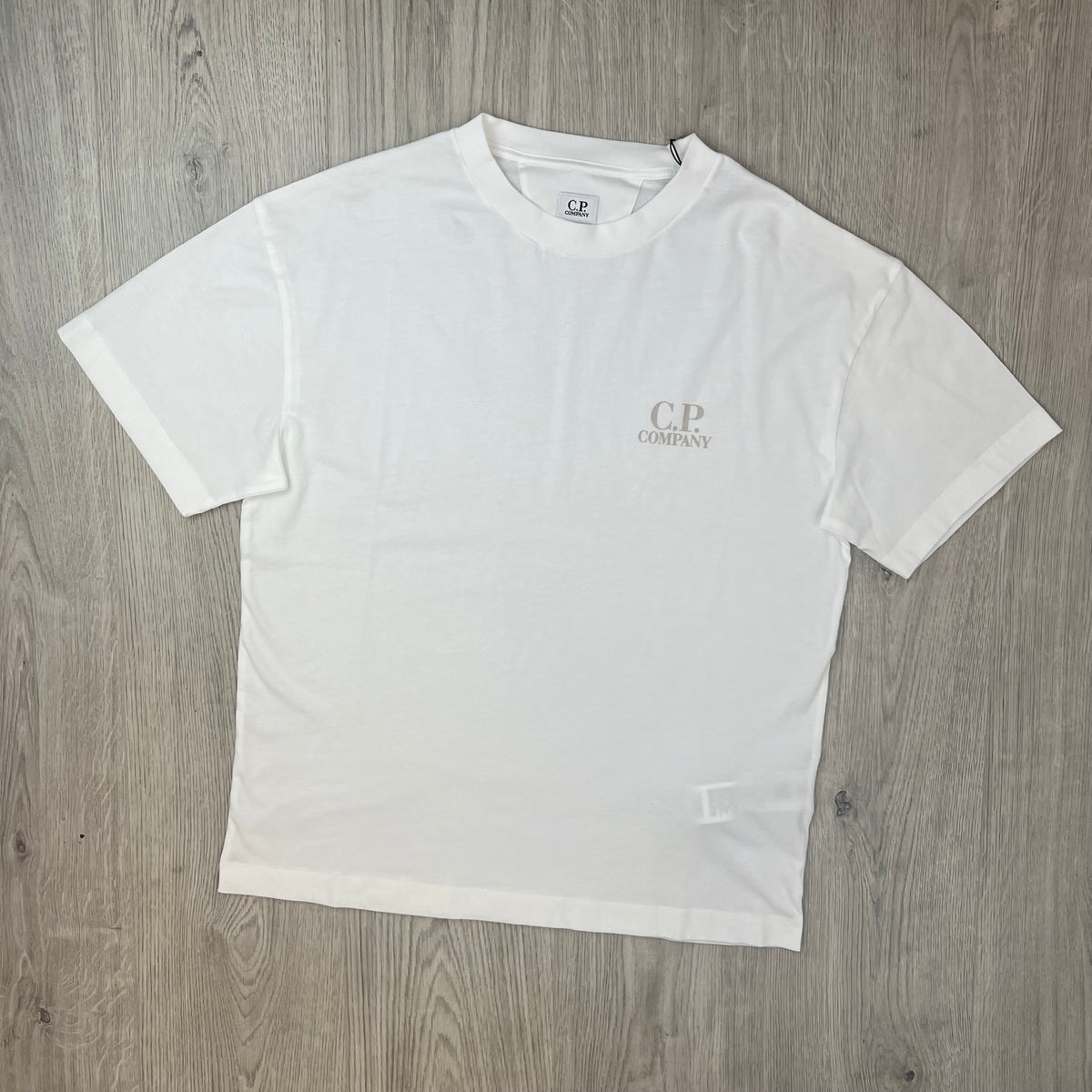Front view of a CP Company 30/1 Logo T-Shirt in Gauze White. 