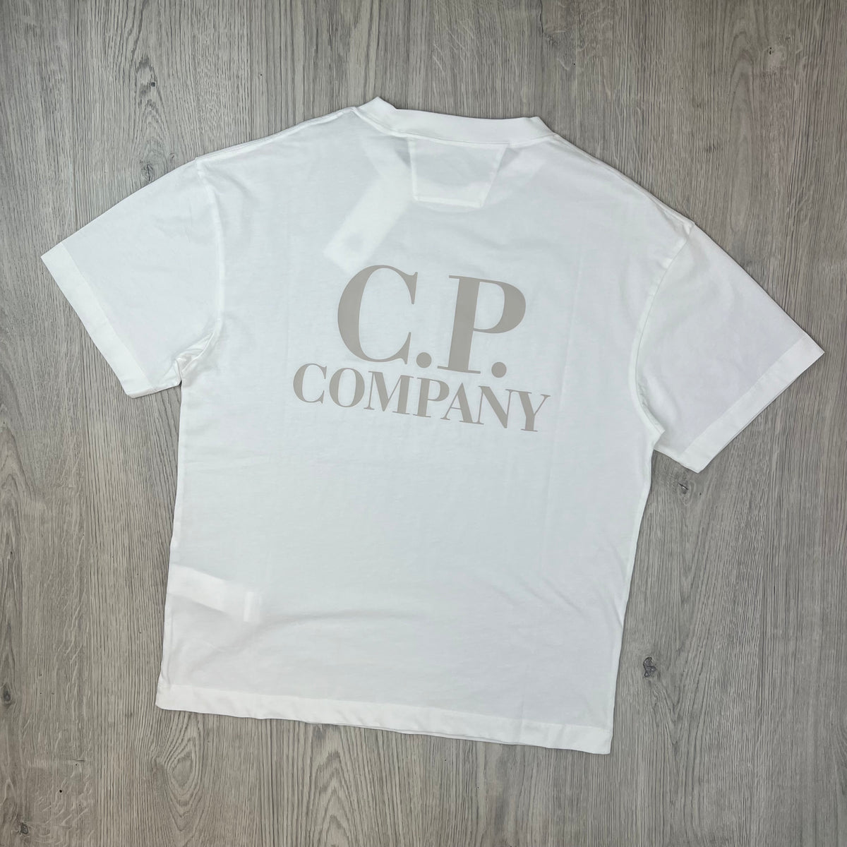 Rear view of a CP Company 30/1 Logo T-Shirt in Gauze White. 