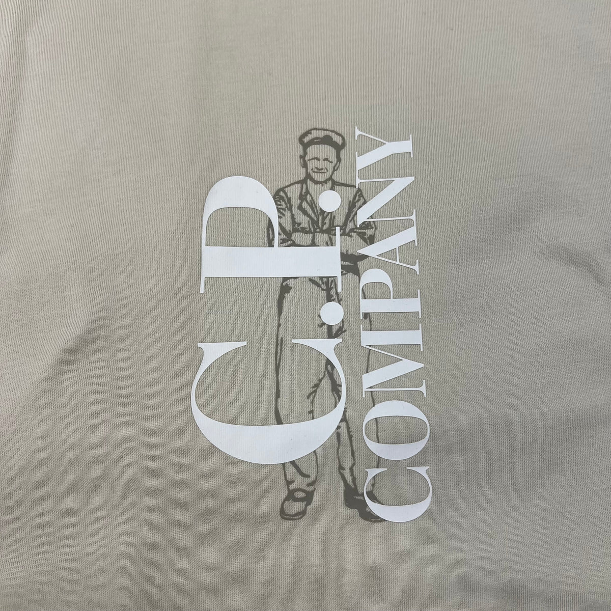 Close up view of the printed logo on the CP Company 30/1 Sailor T-Shirt in Silver Birch. 