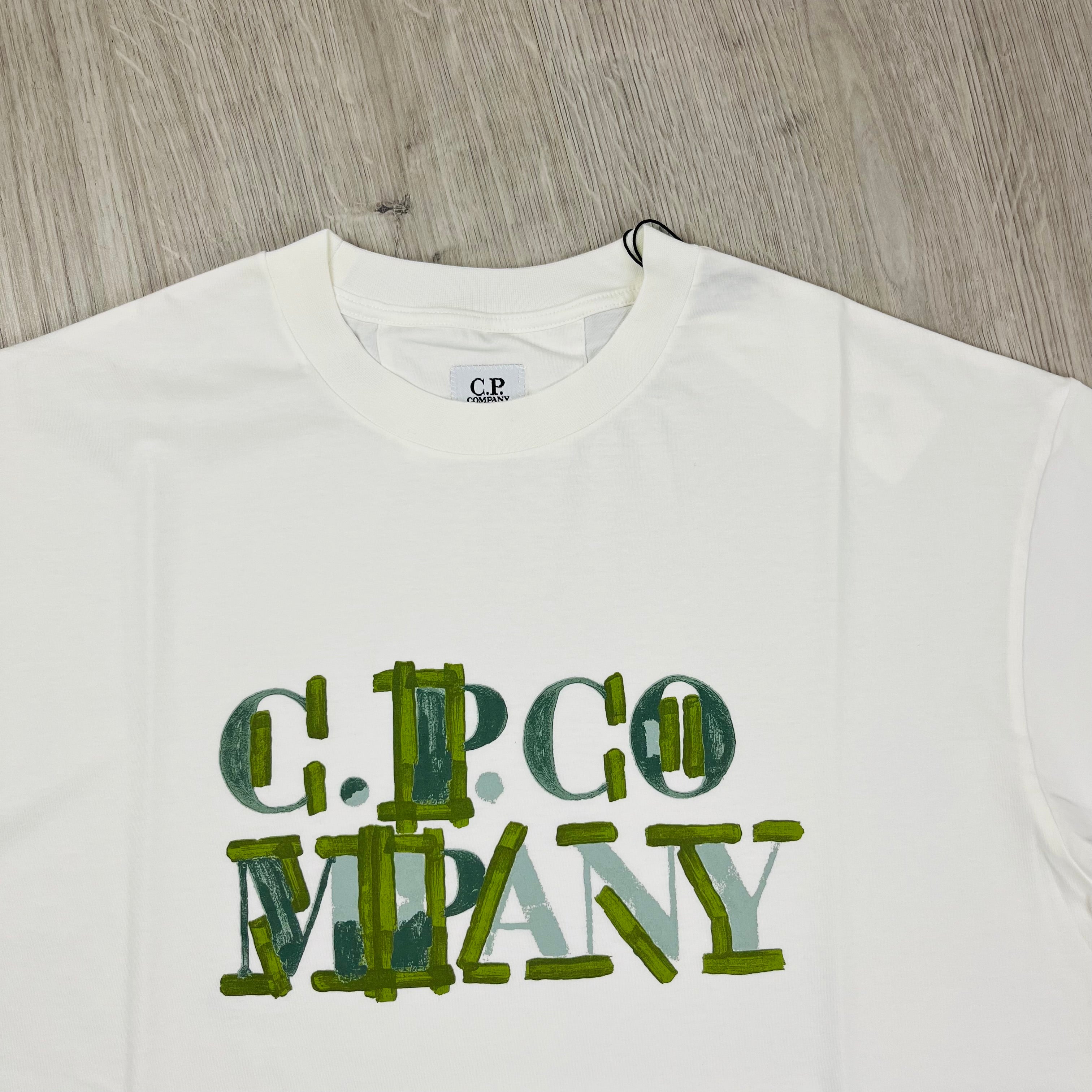 CP Company Blurred Logo T-Shirt in Gauze White. On sale at Open Attire.