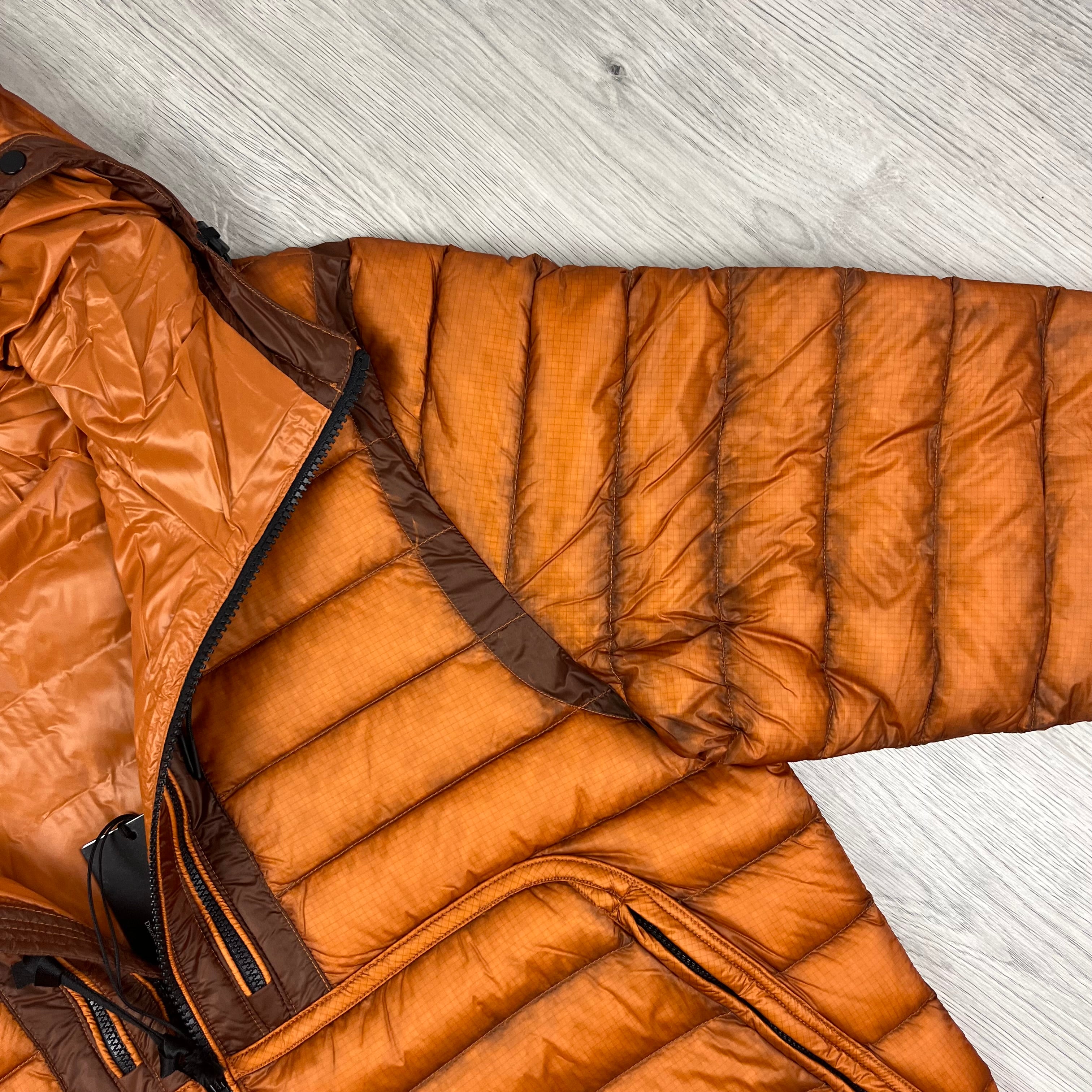 CP Company D.D. Shell Goggle Down Jacket in Bombay Brown. On sale at Open Attire.