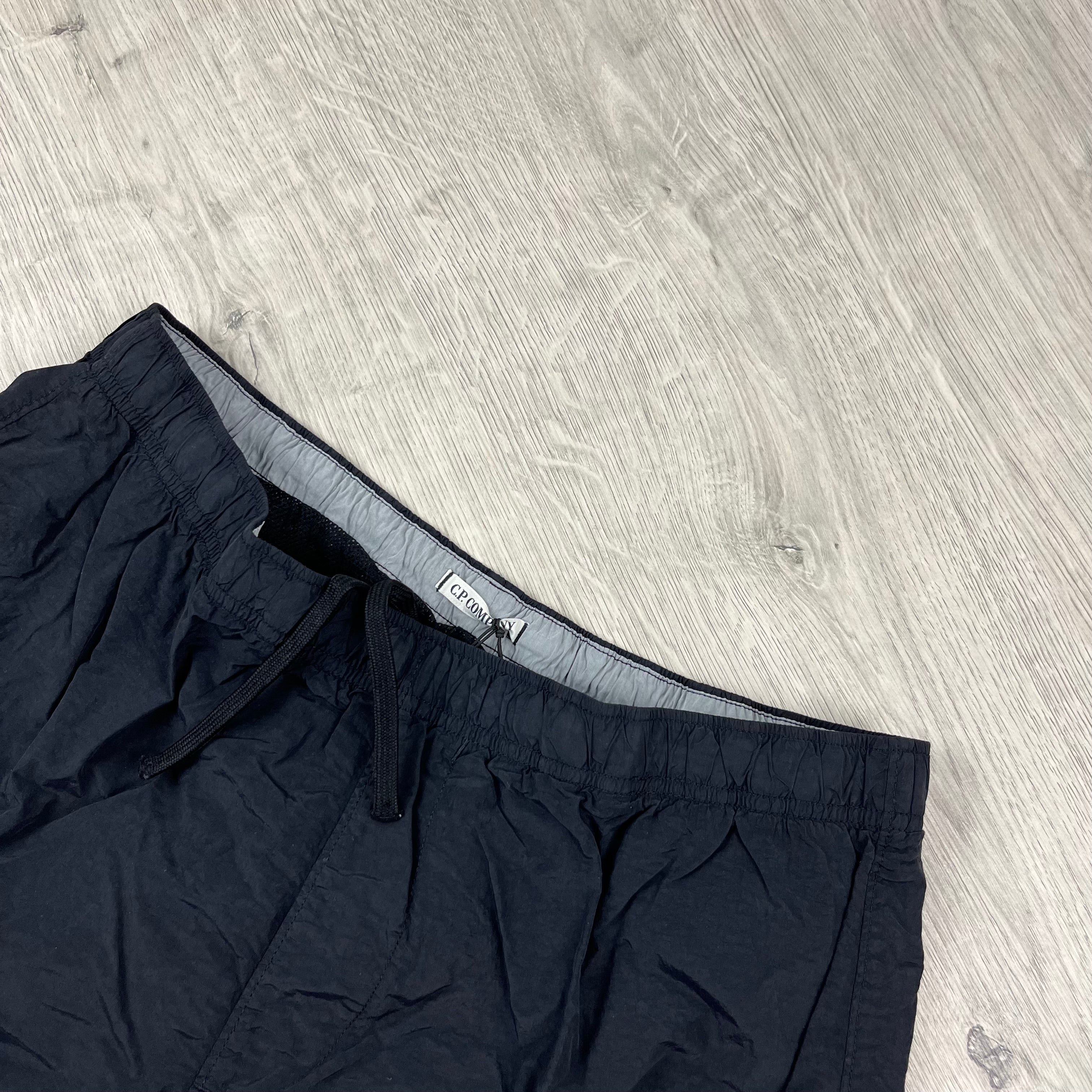 CP Company Flatt Nylon Lens Swim Shorts in Black. On sale at Open Attire.