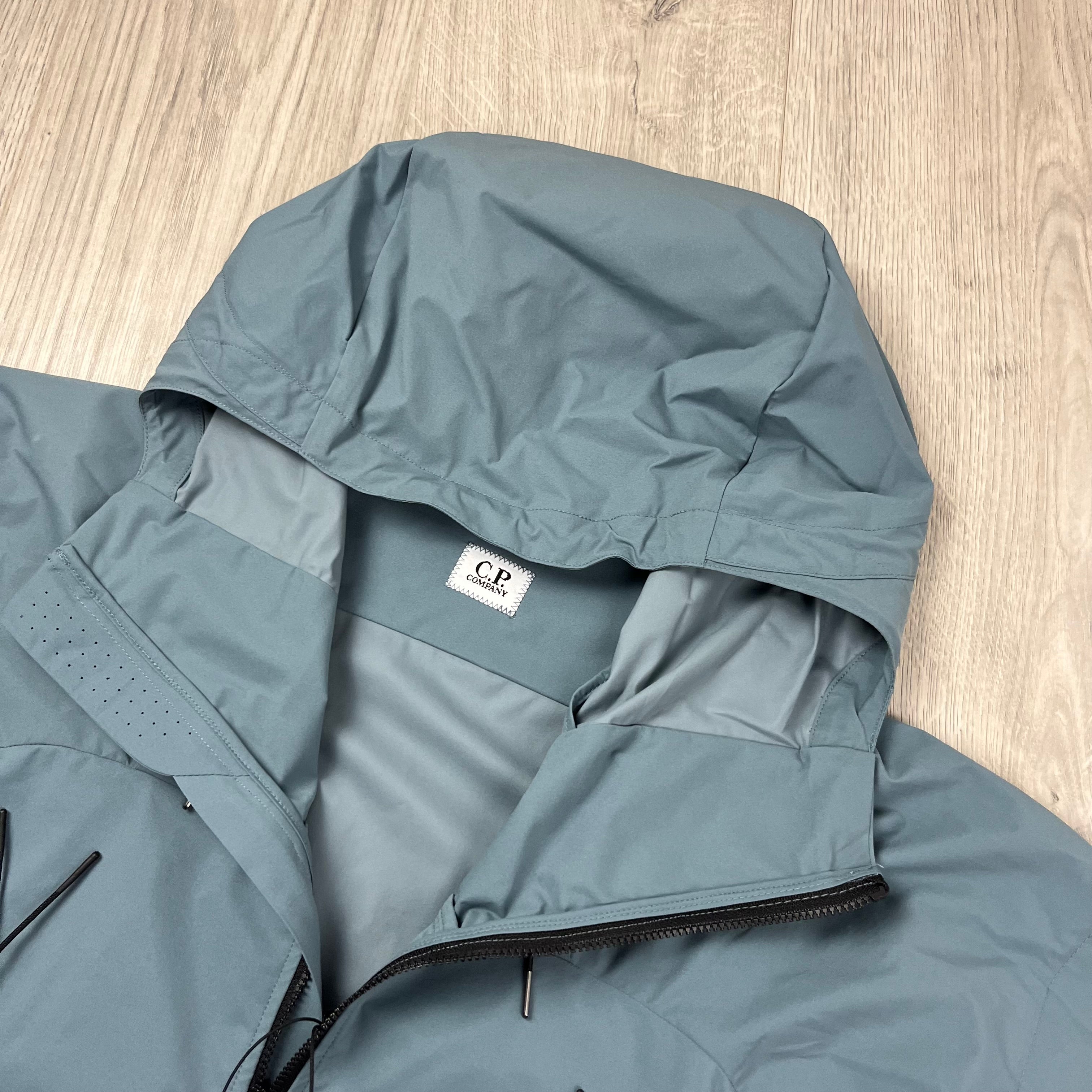 CP Company Pro-Tek Jacket in Stormy Weather Blue. On sale at Open Attire.