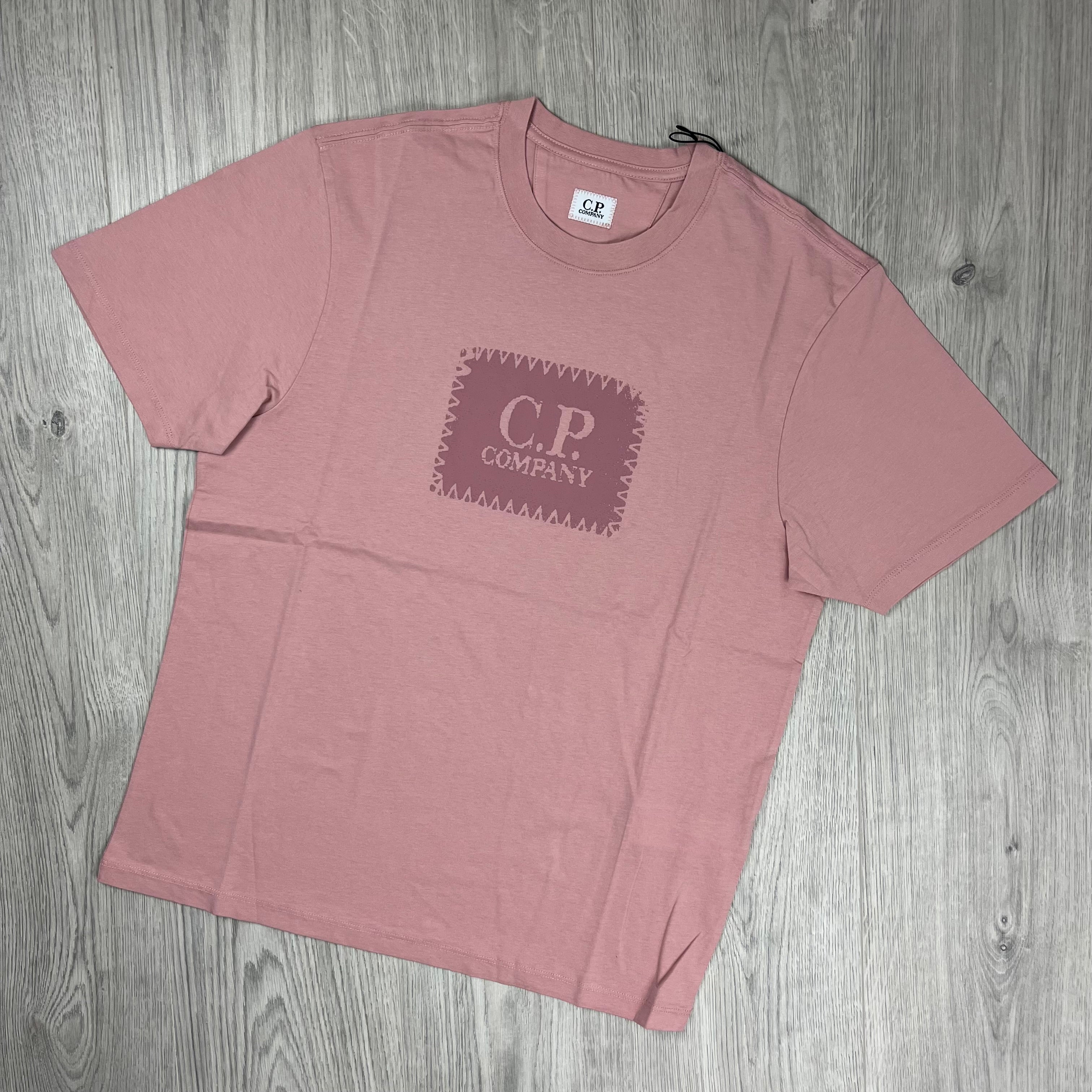 CP Company 30/1 Stamp Logo T-Shirt in Misty Rose. On sale at Open Attire.