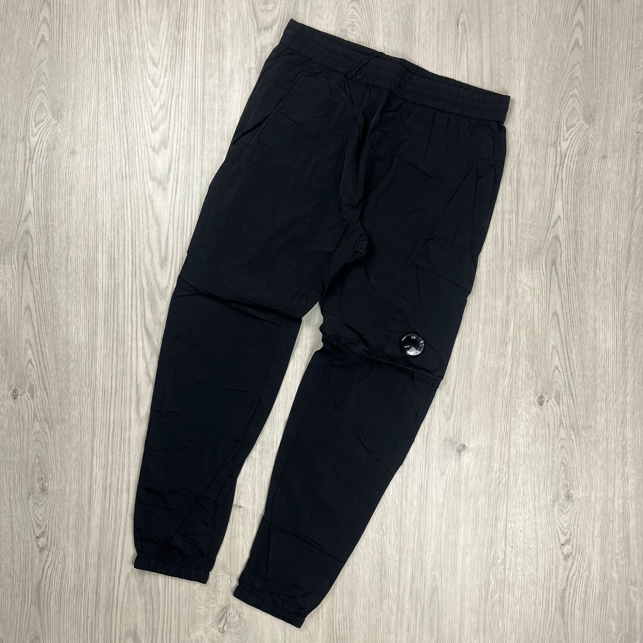 CP Company Chrome-R Track Pants in Black. On sale at Open Attire.