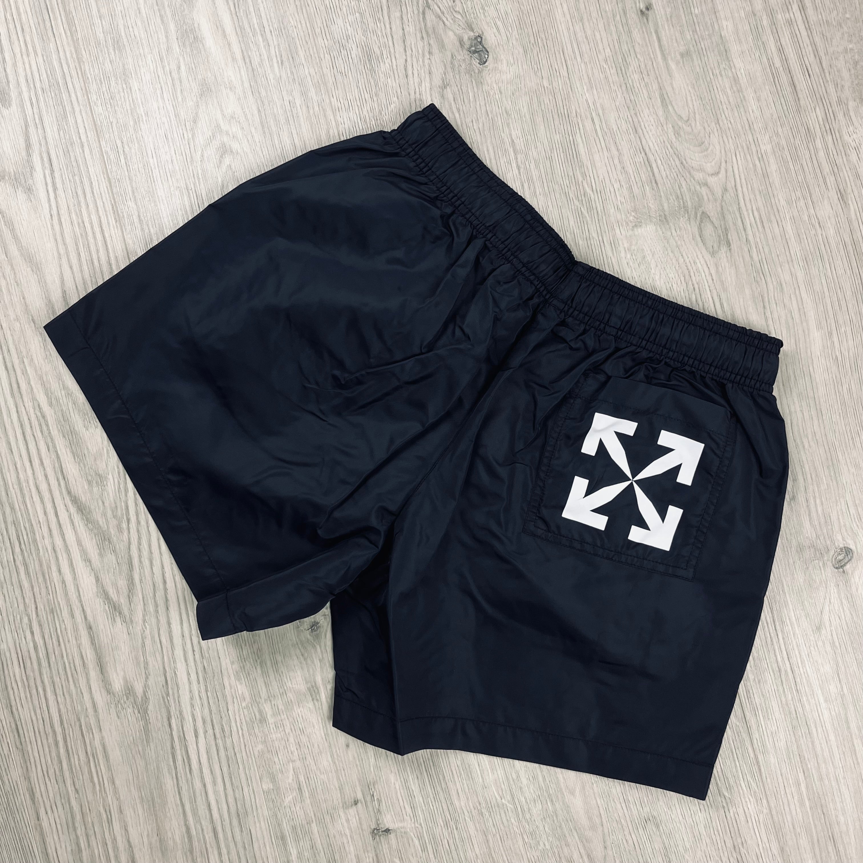 Off-White c/o Virgil Abloh Arrow Swim Shorts in Black. On sale at Open Attire.