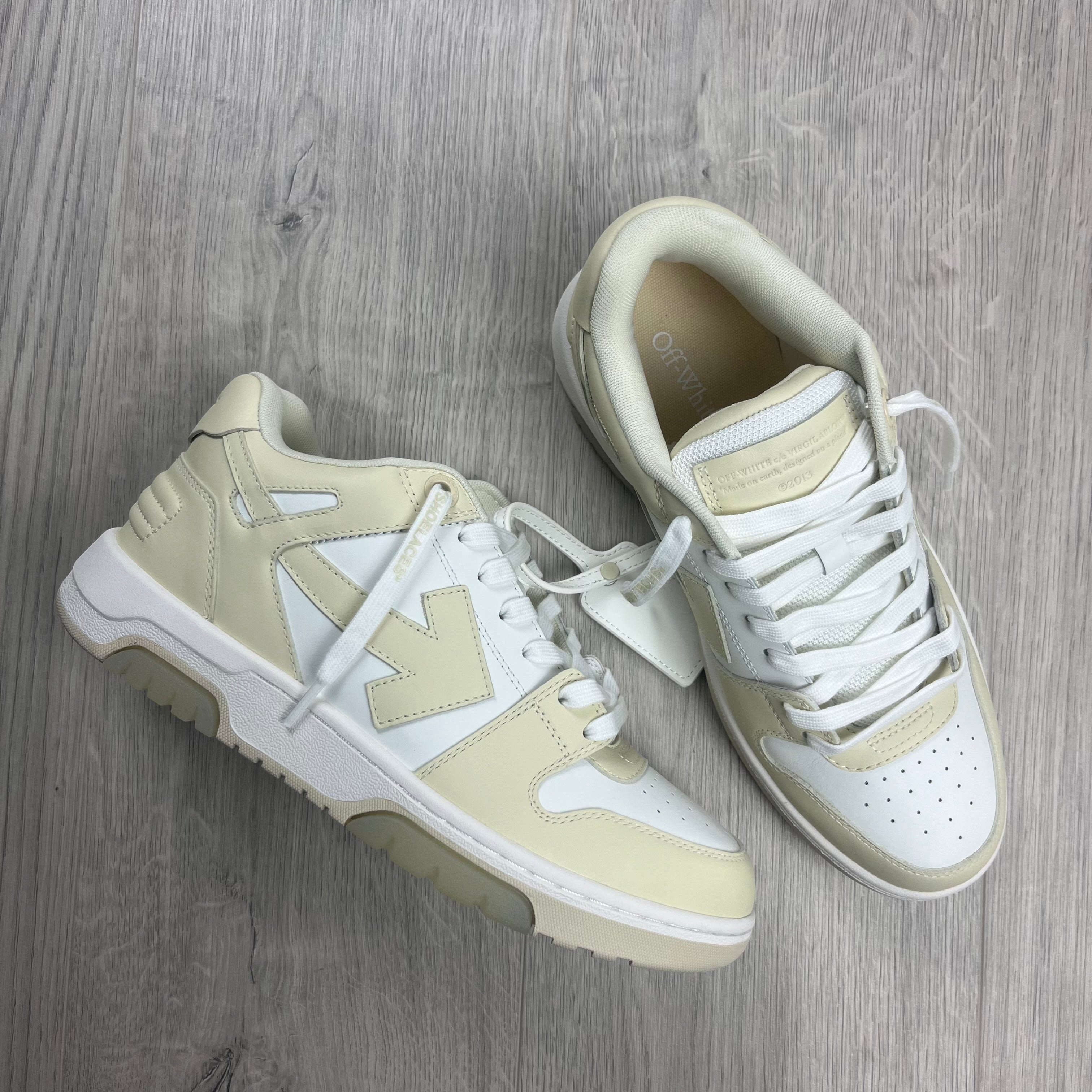 Off-White c/o Virgil Abloh 'Out of Office' Sneakers in Cream. On sale at Open Attire.