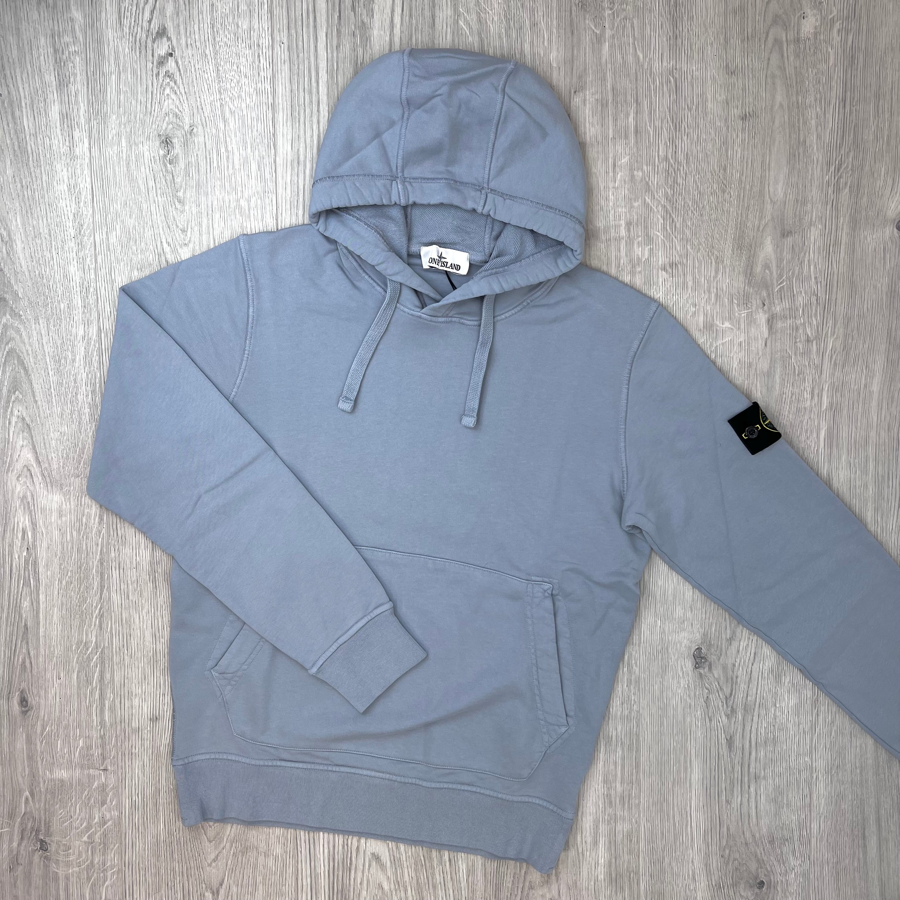 Front view of a Stone Island Pullover Hoodie in Ash Grey. 