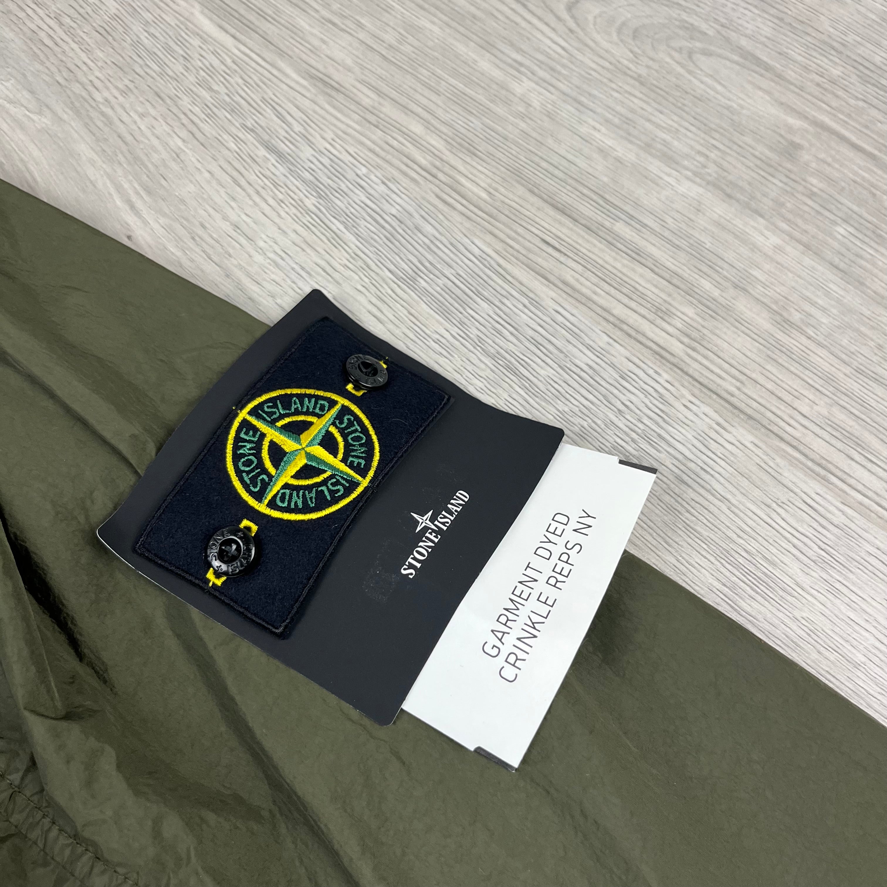 Stone Island Crinkle Reps R-NY Jacket in Military Green. On sale at Open Attire.