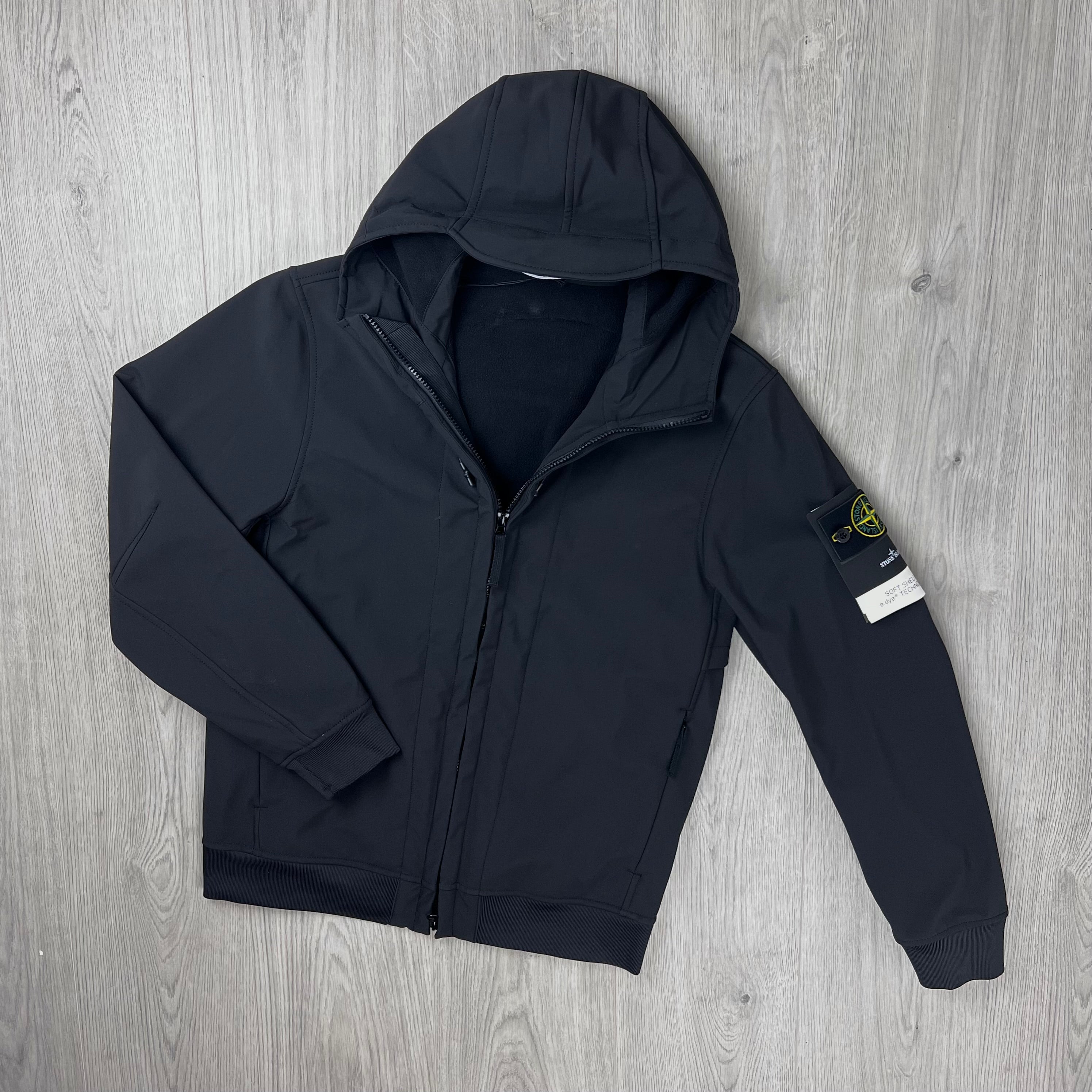 Front view of the Stone Island Soft Shell-R_e.dye® Jacket in Black.
