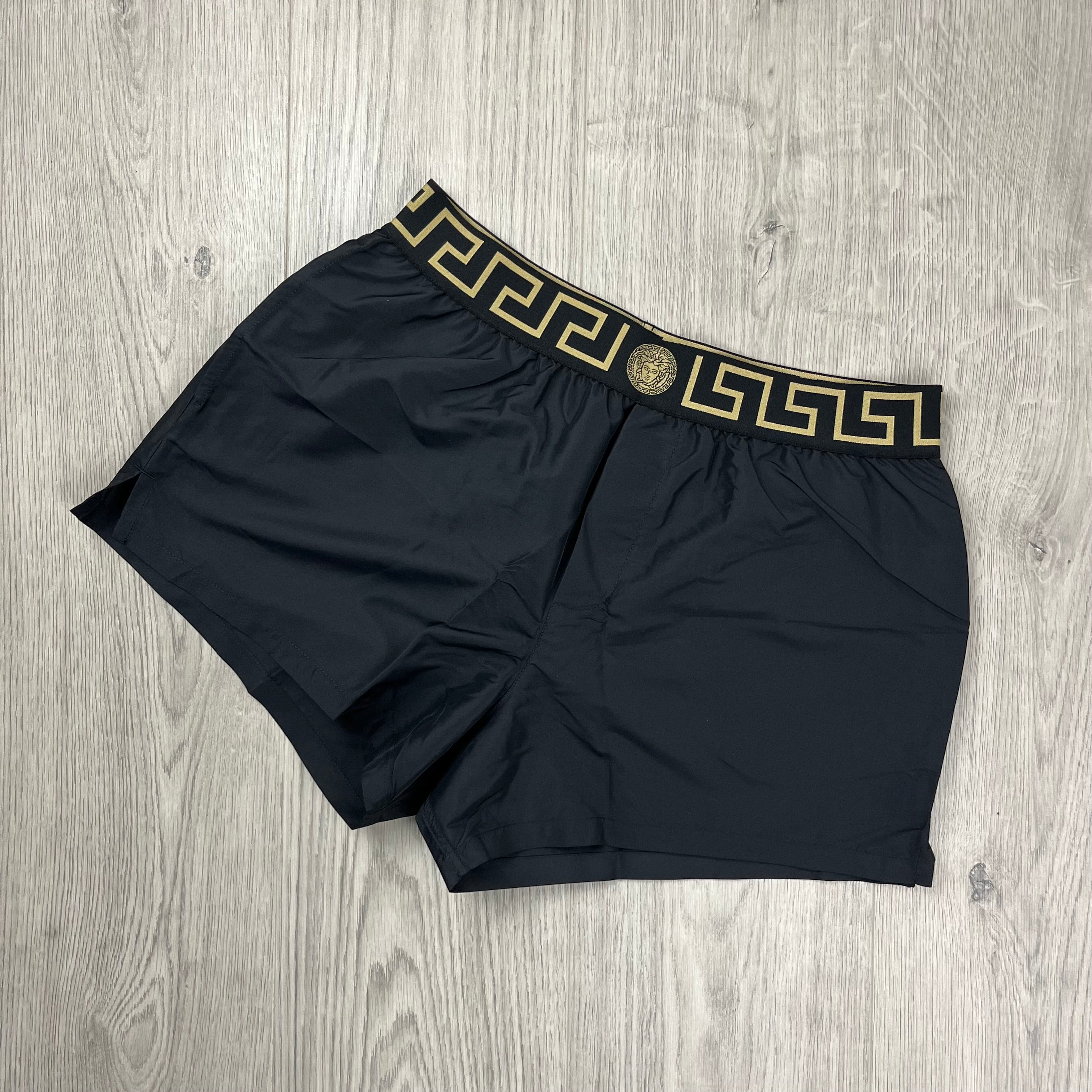 Versace Greca Swim Shorts in Black. On sale at Open Attire.