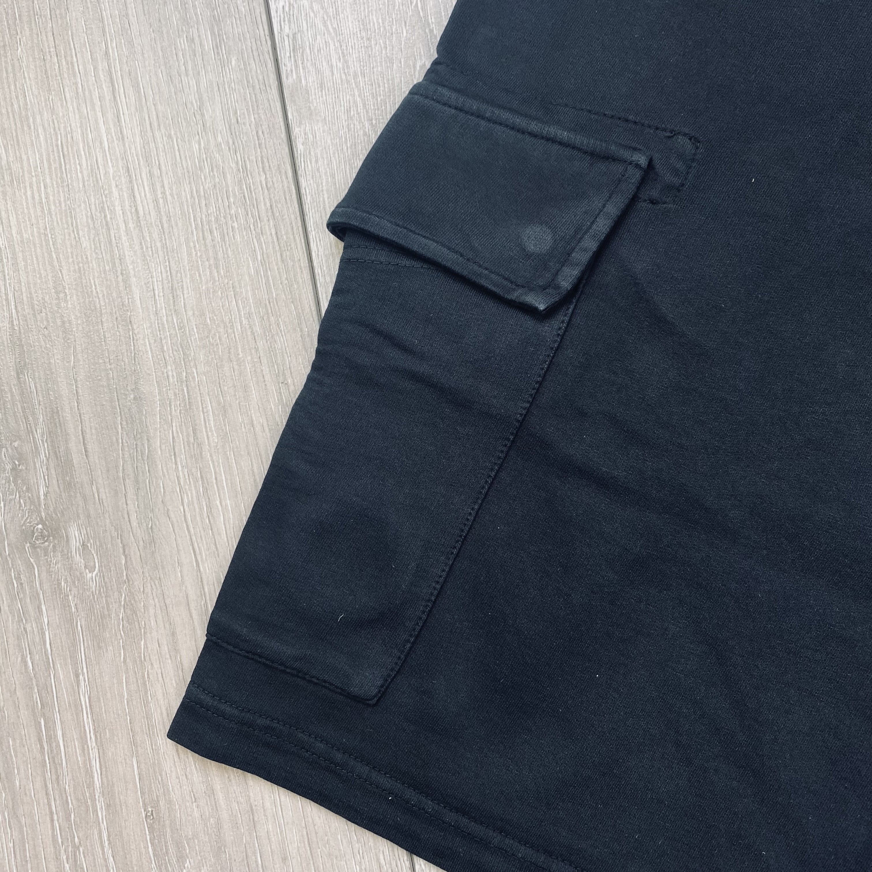 CP Company Light Fleece Jersey Shorts in Black. On sale at Open Attire.